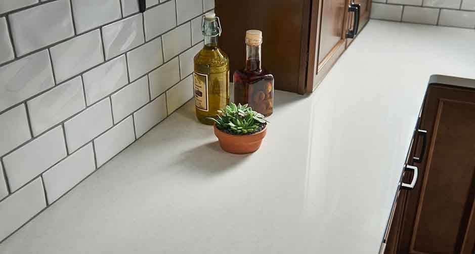 Granite Countertops — White Countertop with Wine in Modesto, CA