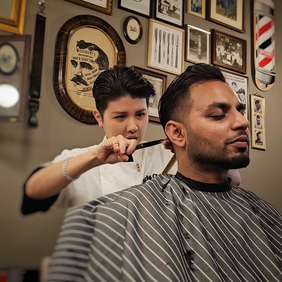Barber Trimming a Client’s Hair in a Classic Barbershop — Lucky Child Barber Shop In Hobart, TAS