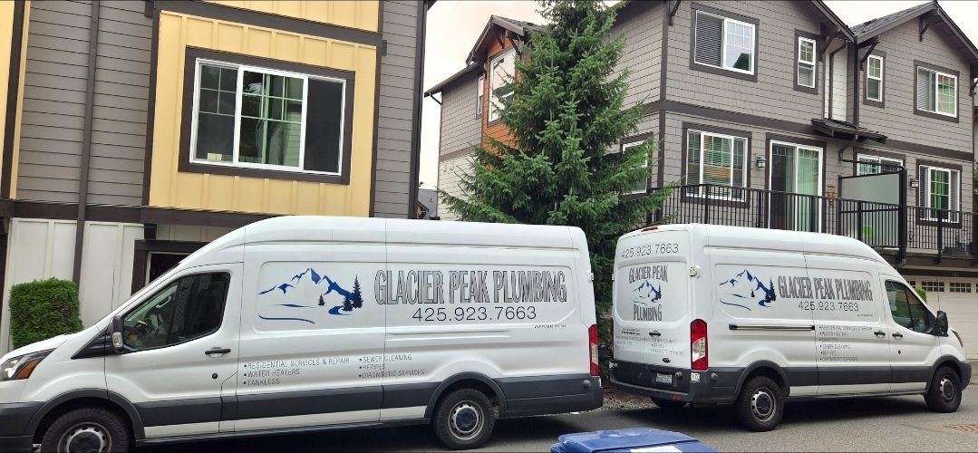 Wooden construction interior with a red fixture on a plywood wall.
