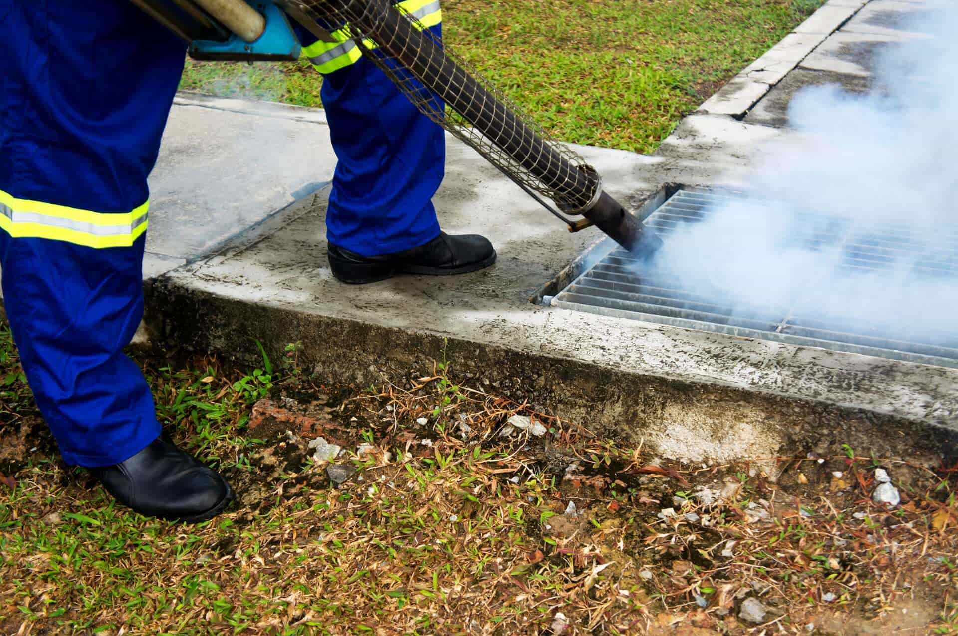 Council Worker Fogging Ground Vent - Pest Control in Mudgee NSW