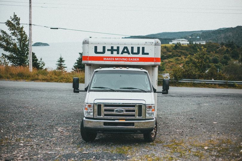 U-Haul white van on dirt road