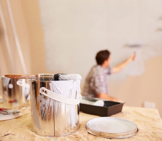 Painting — Paint Bucket with Paint Brush in Apartment in Seattle, Washington