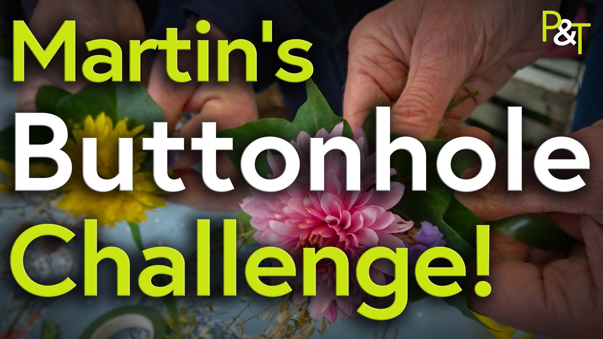 Closeup of two hands working on a bench one hand on the left is manipulating a yellow flower, the hand on the right is working on a pink flower. On top is the text Martins Buttonhole Challenge in green and white