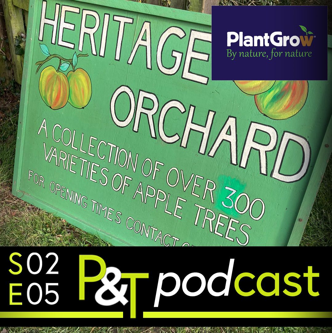 Closeup of hand painted sign saying Heritage Orchard A collection of over 300 varieties of apple trees - for opening times contact.... and the episode details and PT logo in green and white.
