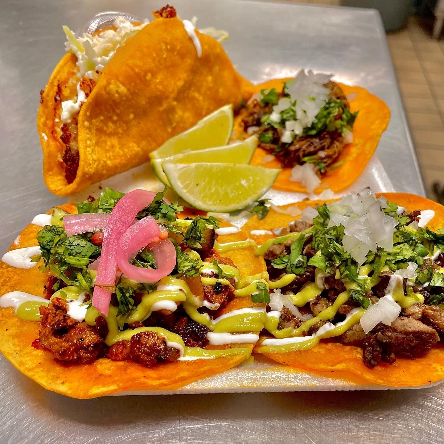 Upscale Sonoran-style tacos topped with pickled onions and cilantro for Phoenix catering events