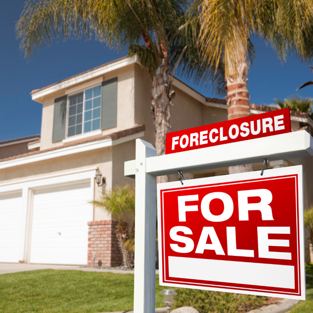 A for sale sign in front of a house