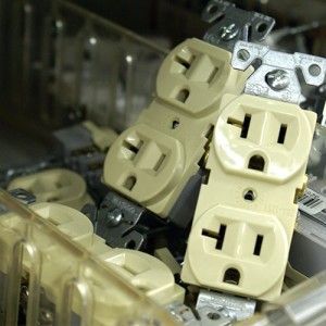 A bunch of electrical outlets are stacked on top of each other