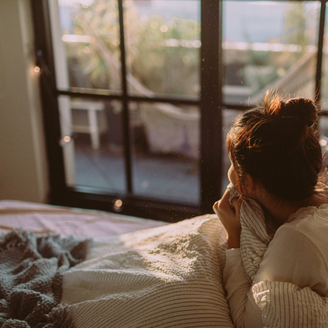 Woman waking up with morning anxiety