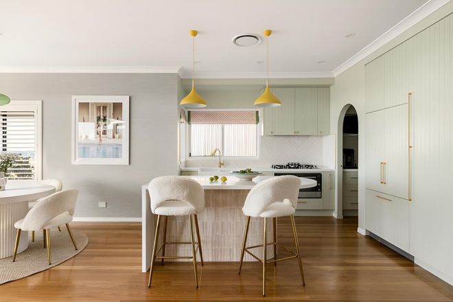 A Kitchen With White Cabinets and Marble Counter Tops — CK Cabinetry in Coolum Beach, QLD