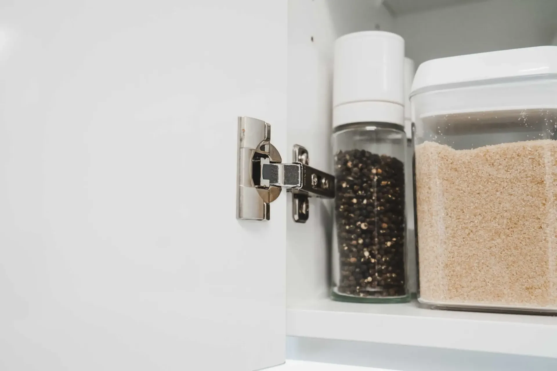 A Cabinet With a Bottle of Pepper and a Container of Grains on a Shelf — CK Cabinetry in Coolum Beach, QLD