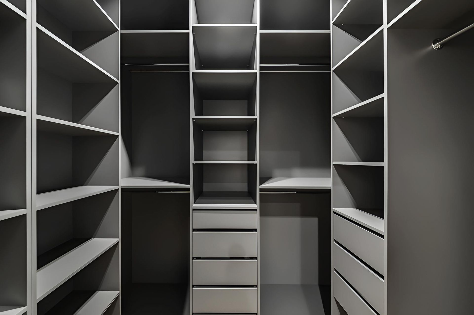 Empty modern walk-in closet with gray shelves, drawers, and hanging rods — CK Cabinetry in Coolum Beach, QLD