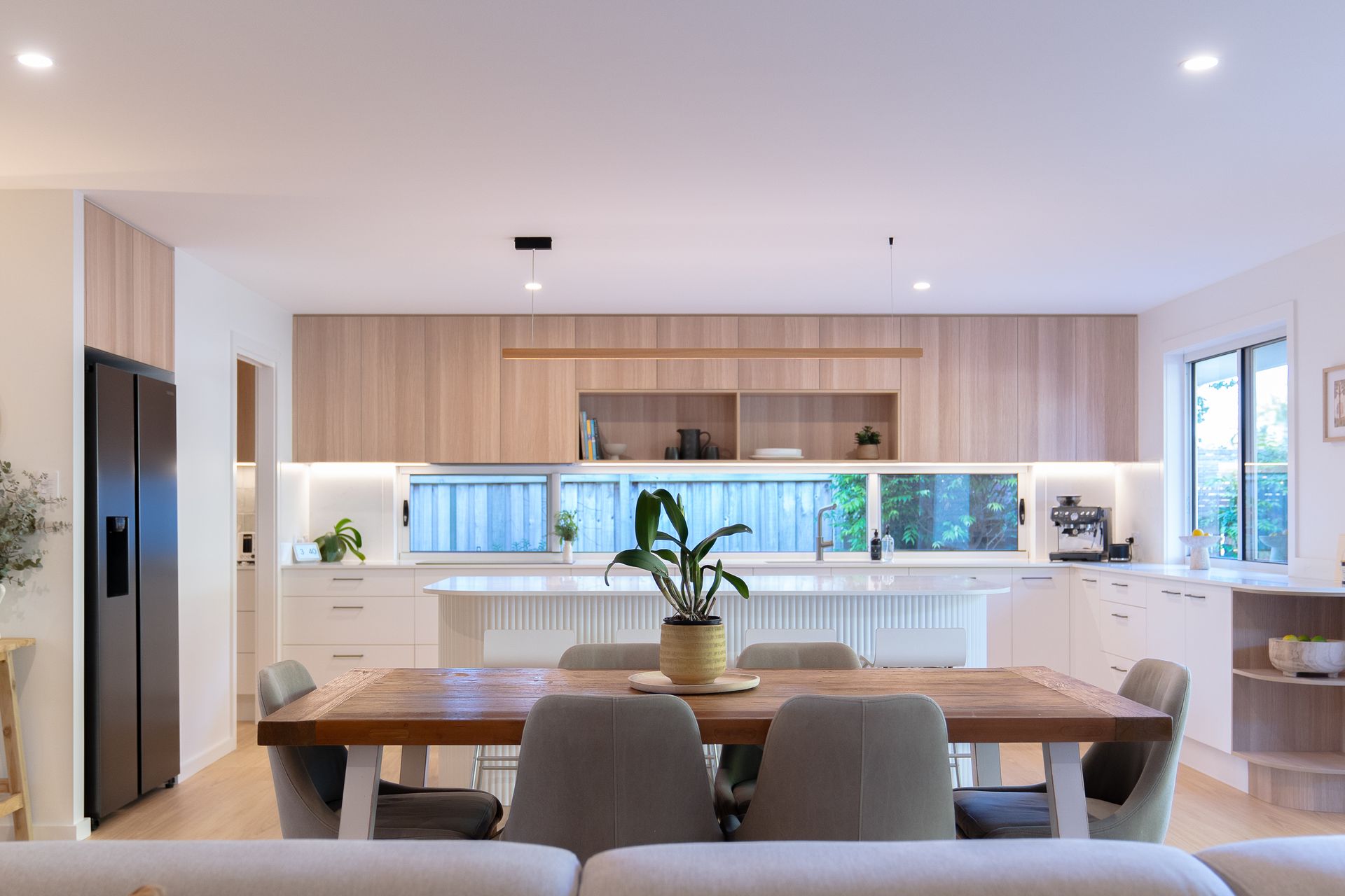 A Kitchen With a Stove Top Oven and a Painting on the Wall — CK Cabinetry in Caloundra, QLD