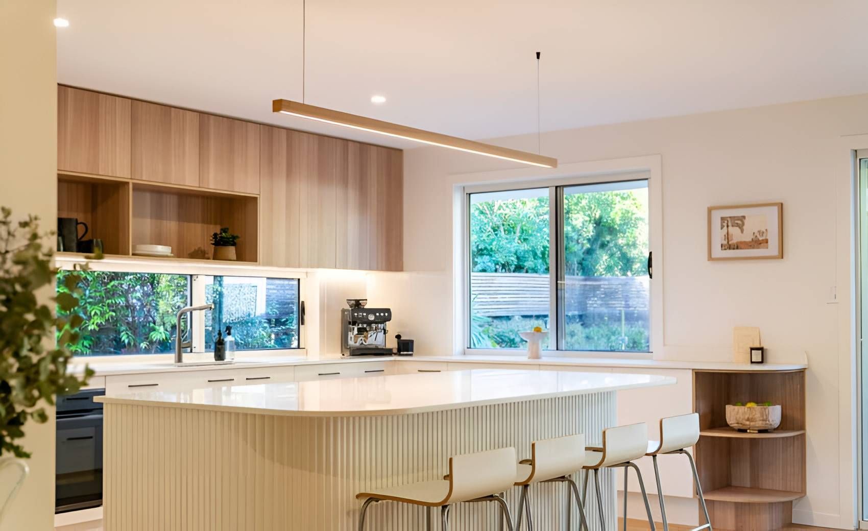 A Kitchen With a Large Island in the Middle of It and a Lot of Windows — CK Cabinetry in Coolum Beach, QLD