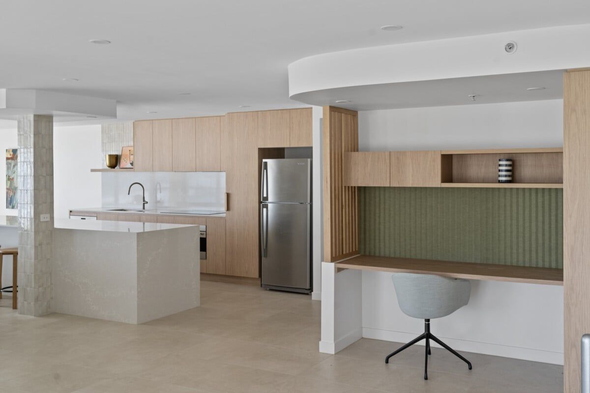A Kitchen With a Stainless Steel Refrigerator and a Desk With a Chair — CK Cabinetry in Coolum Beach, QLD