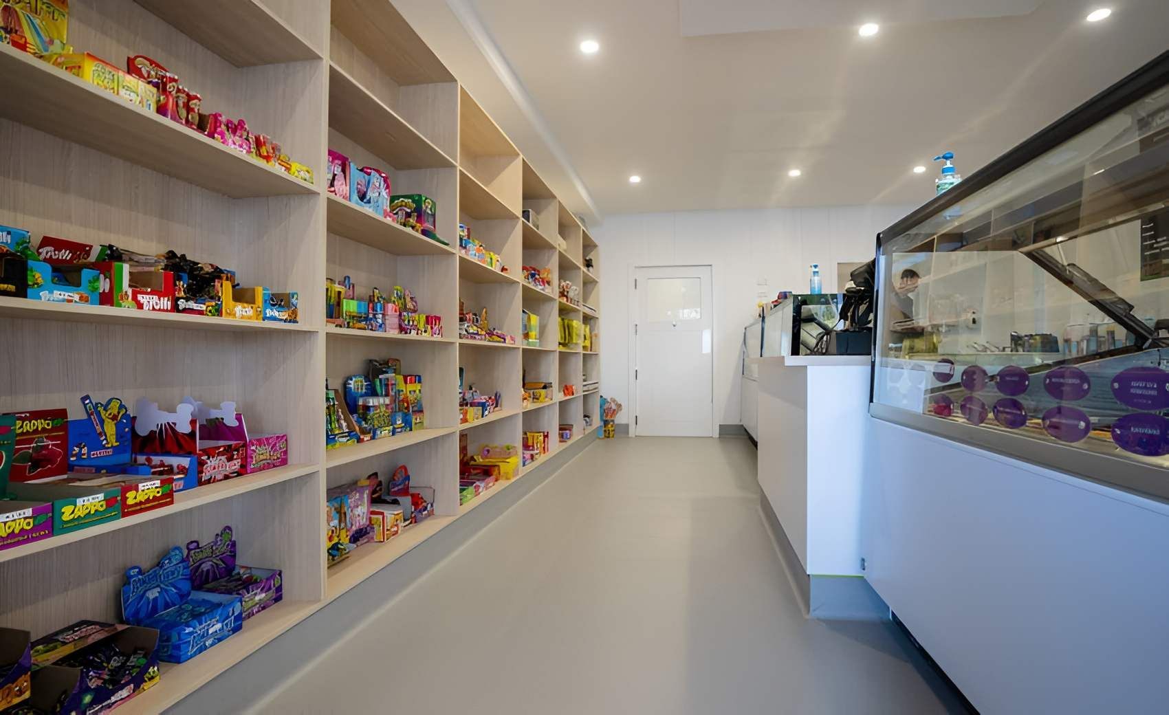 A Long Hallway Filled With Shelves Filled With Candy in a Store — CK Cabinetry in Coolum Beach, QLD