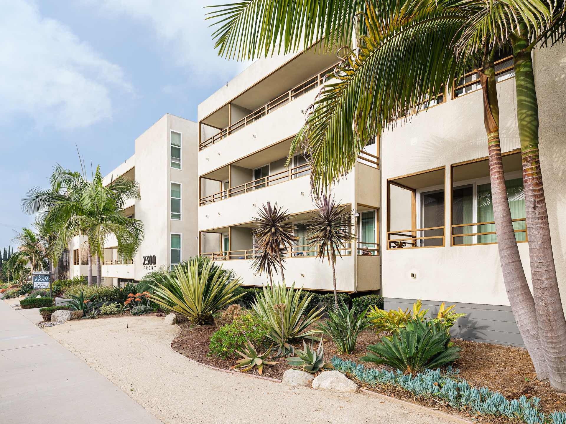 Exterior of apartments with palm trees and balconies
