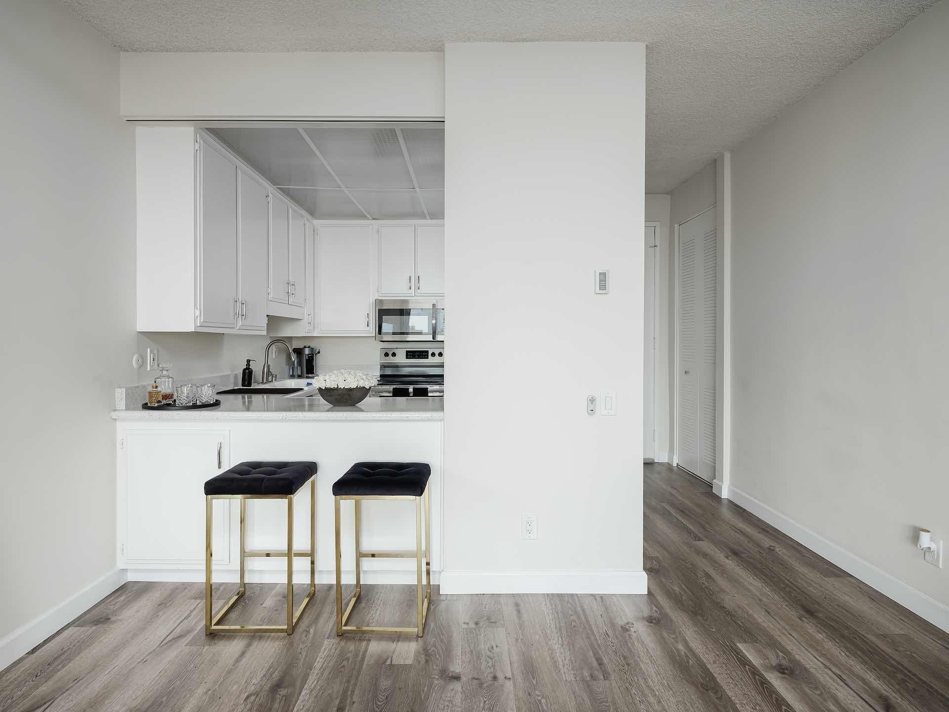 Kitchen island and entryway to apartment