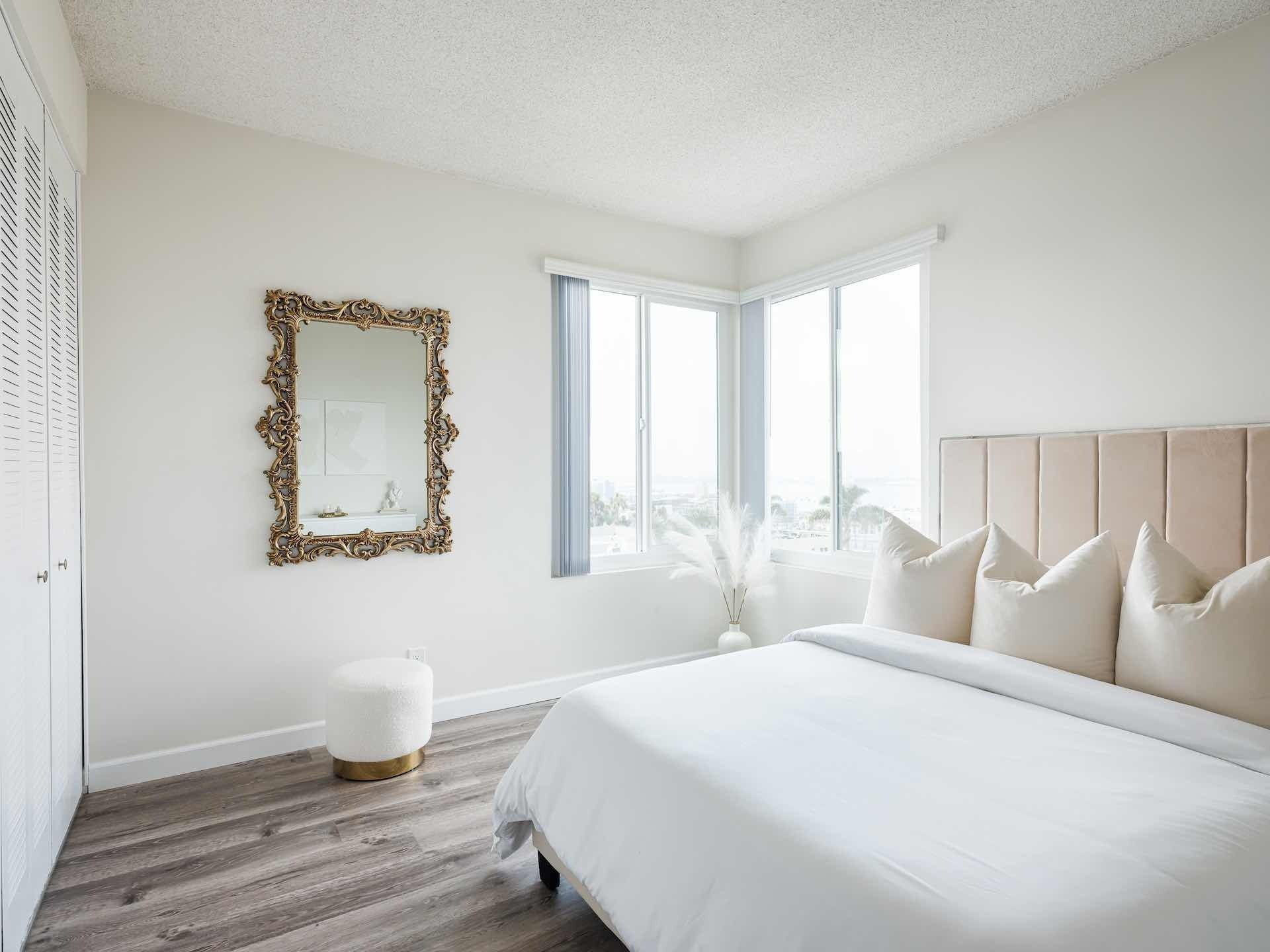 Kitchen with white cabinetry and full appliances
