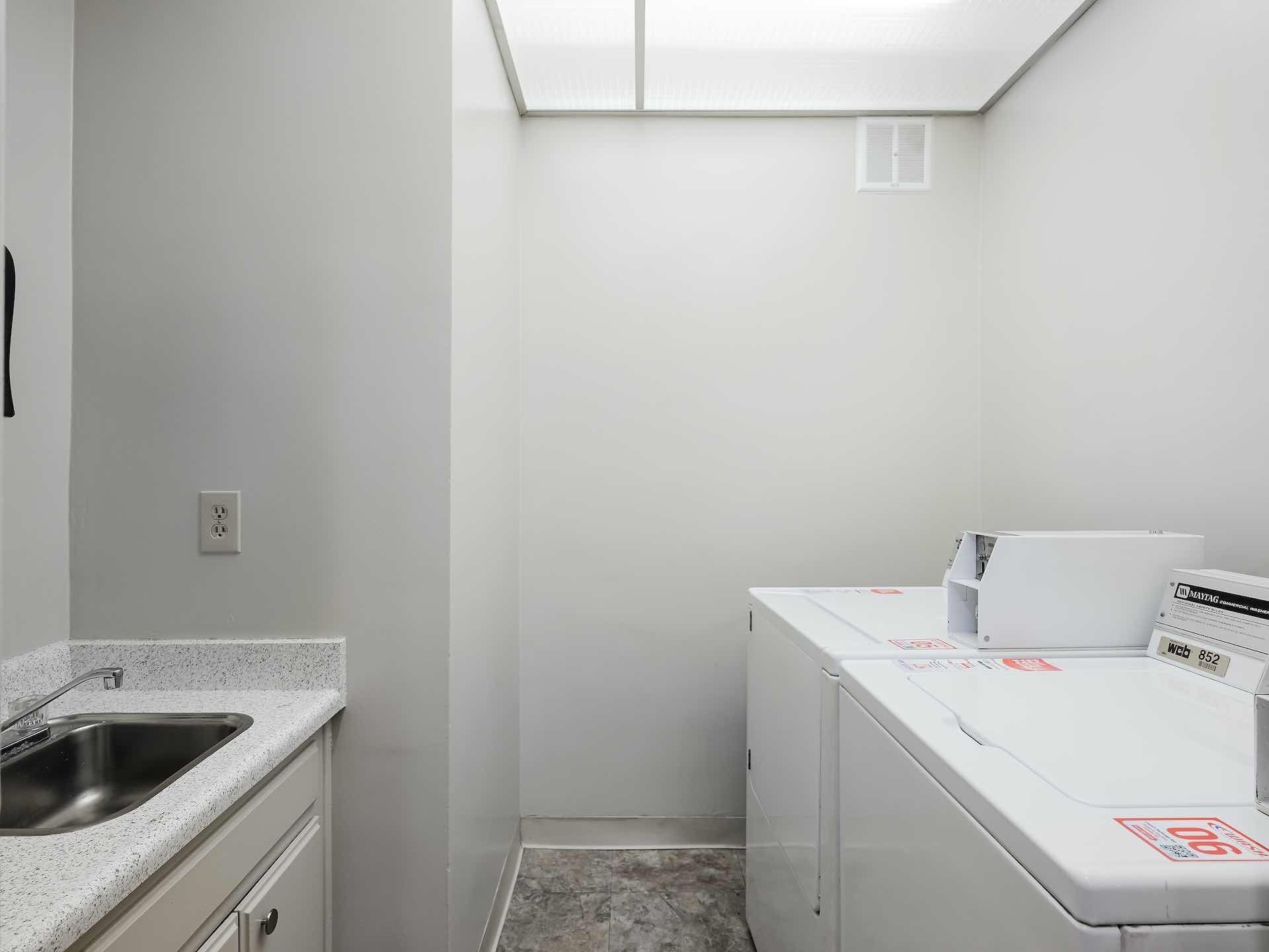 Bathroom with white fixtures and walls