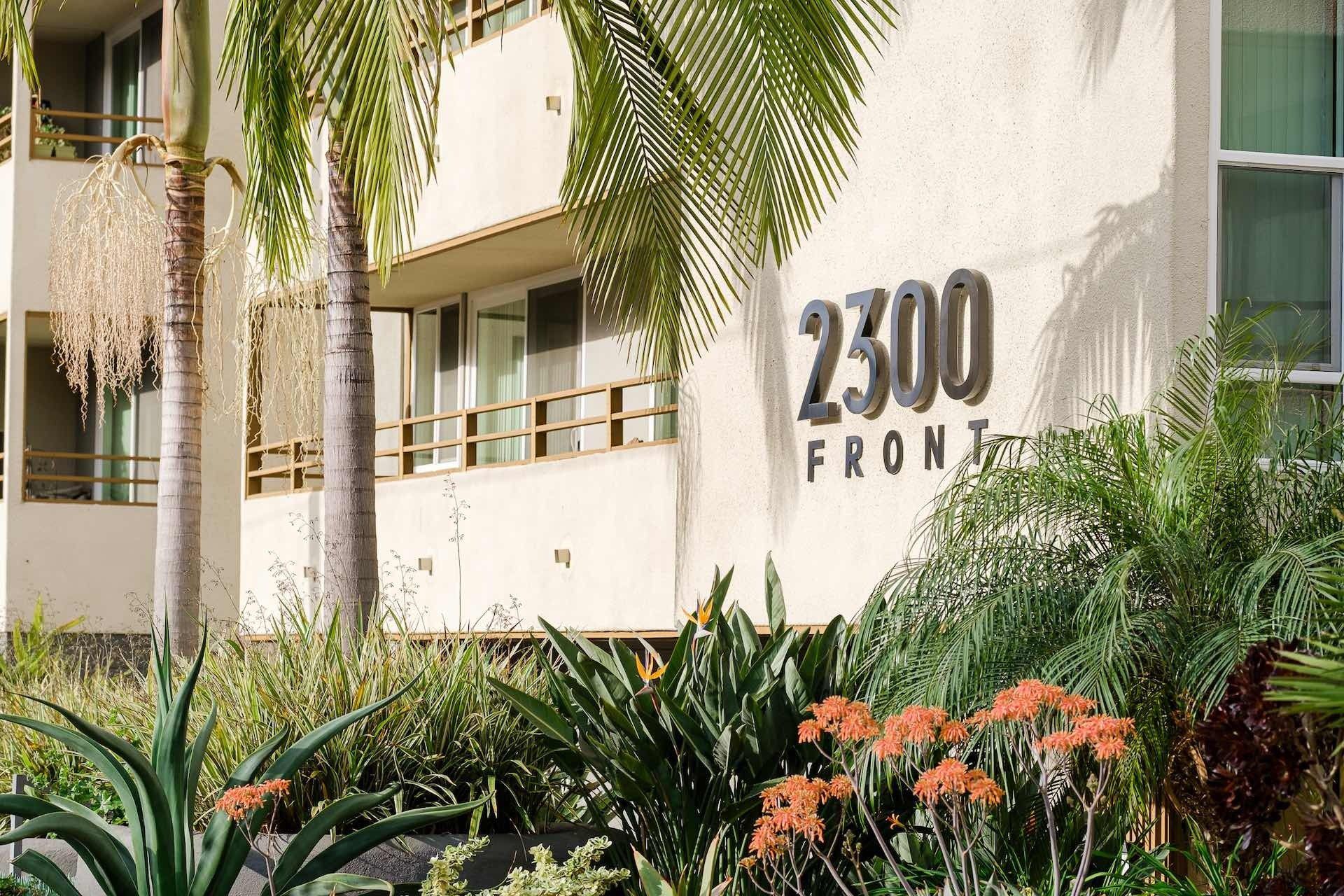 Exterior of apartment building with palm trees