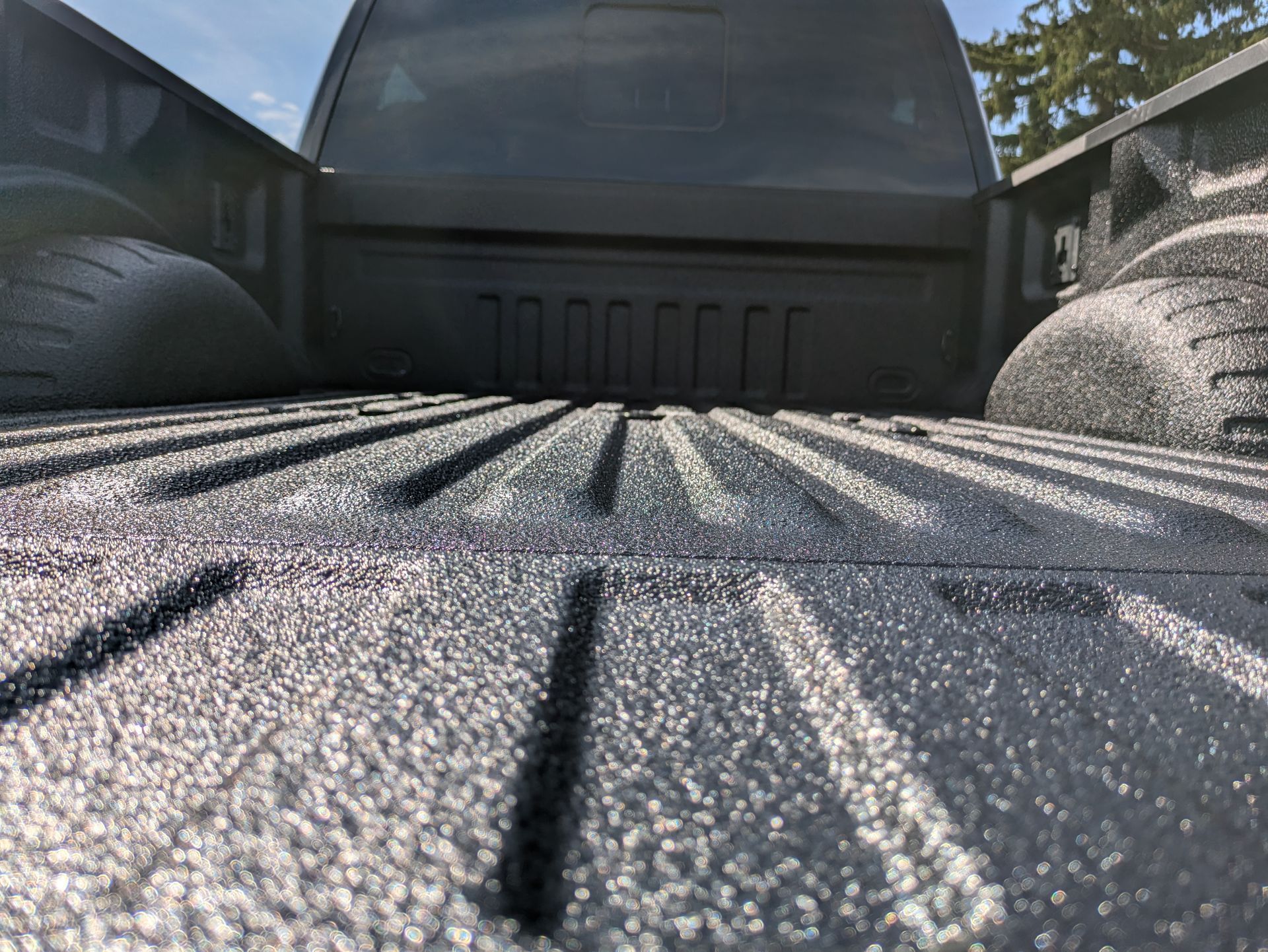 A close up of the back of a truck 's bed.