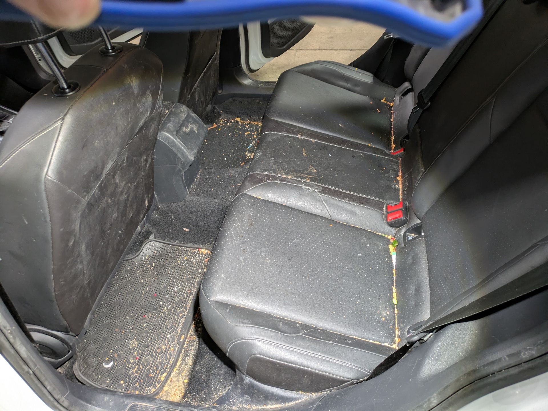 The inside of a vehicle with a steering wheel and seats.