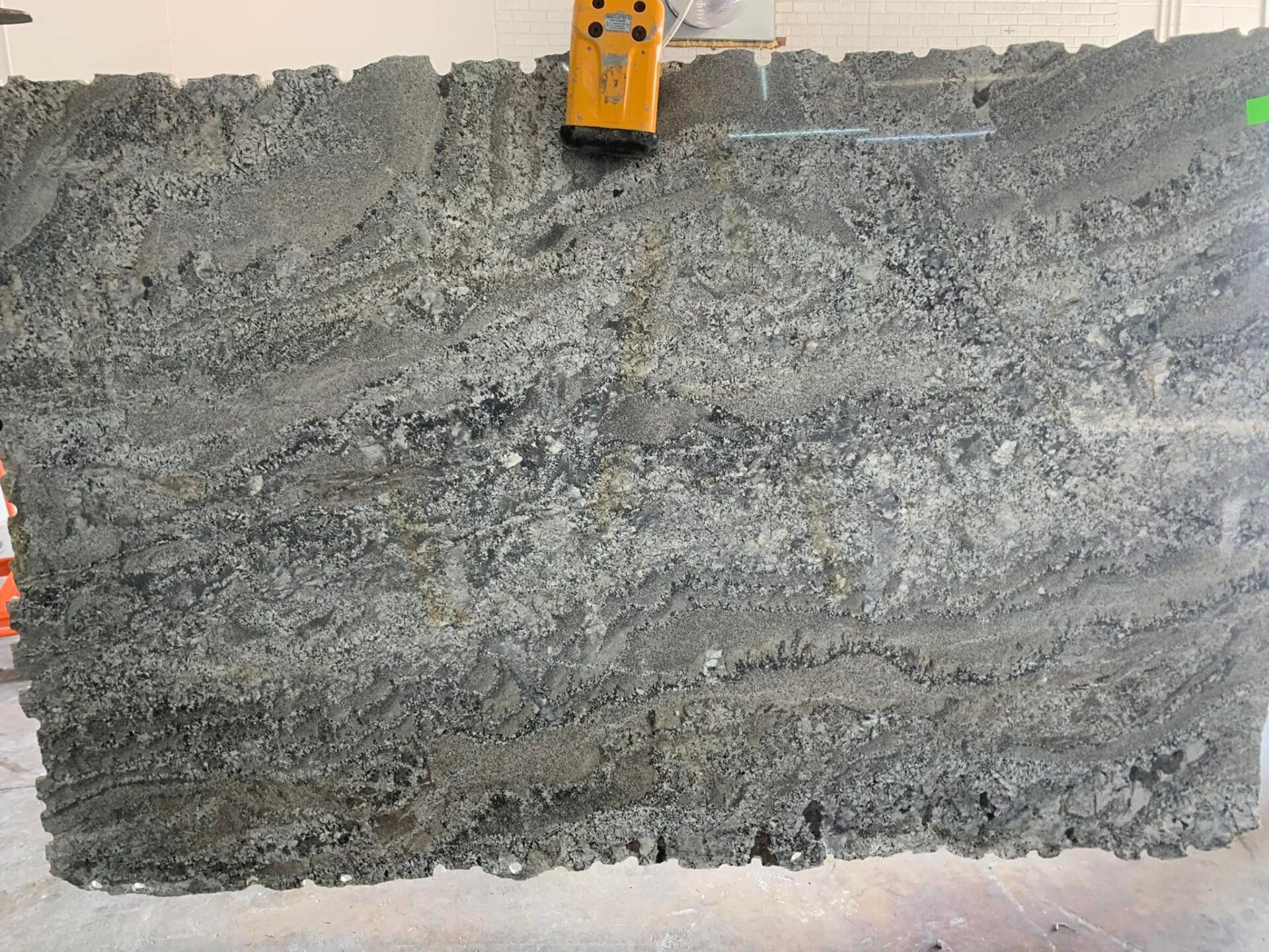 A large piece of granite is sitting on a table.