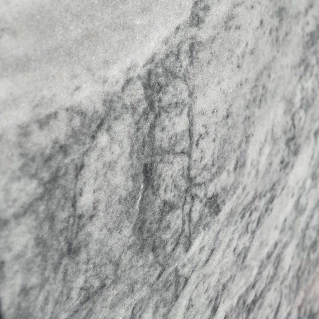 A close up of a gray marble counter top.