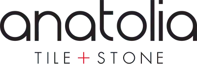 The logo for anatolia tile and stone is black and white.