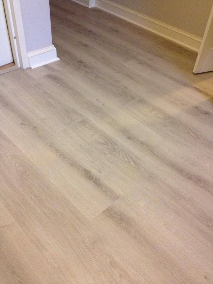 A close up of a wooden floor in a room.