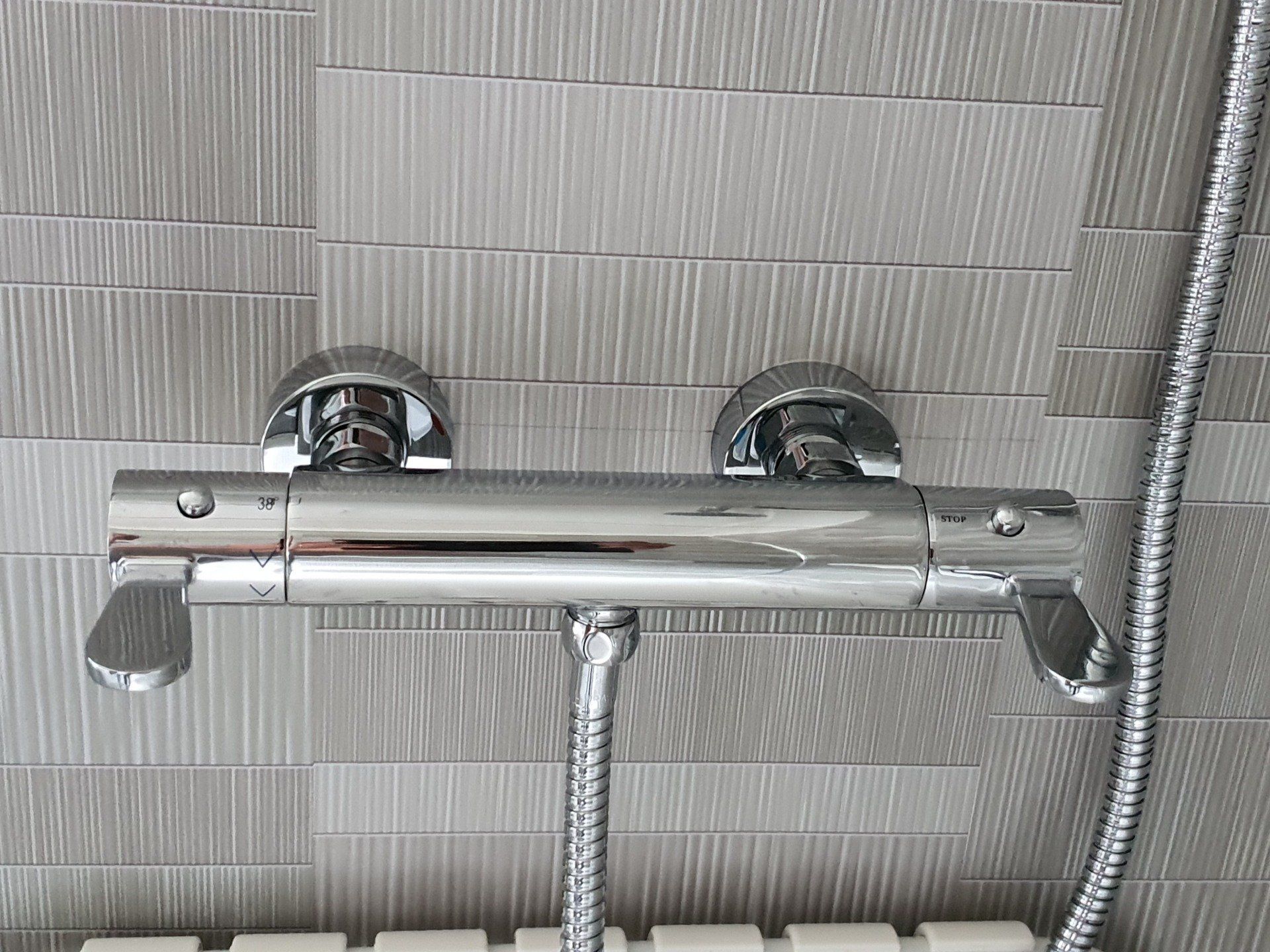 Anti scald shower taps in accessible bathroom