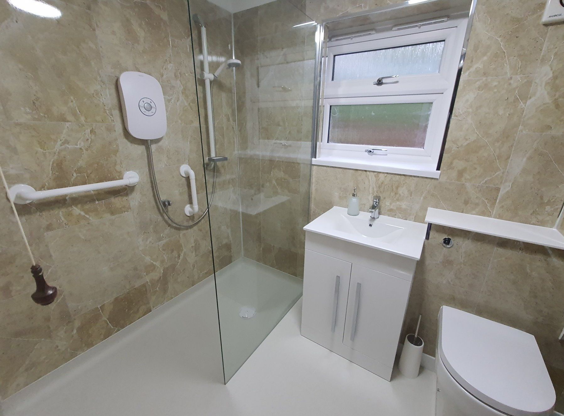 picture of an accessible bathroom with grab rails