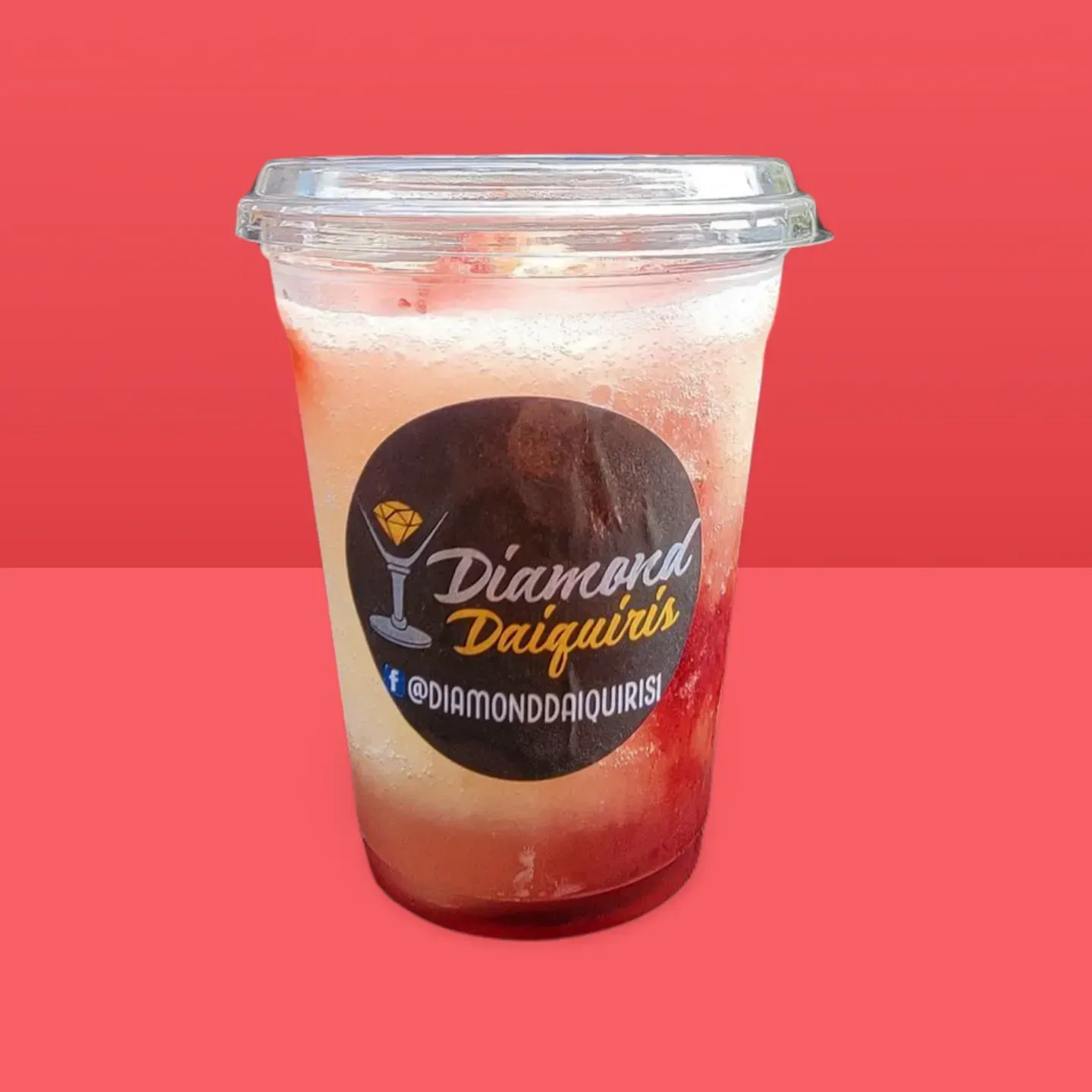 Clear plastic cup of Diamond Daiquiri drink on a pink background