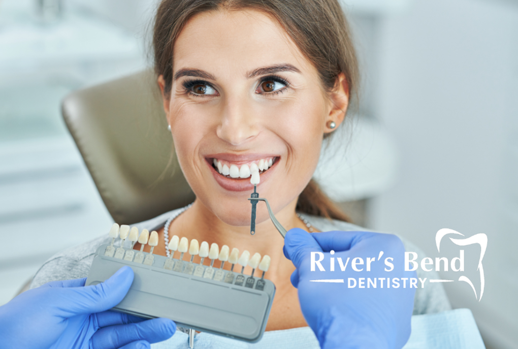 Woman being presented with color options for her porcelain veneers.