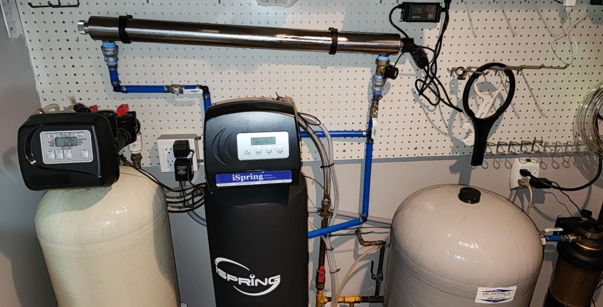 A water treatment system is installed in a basement.