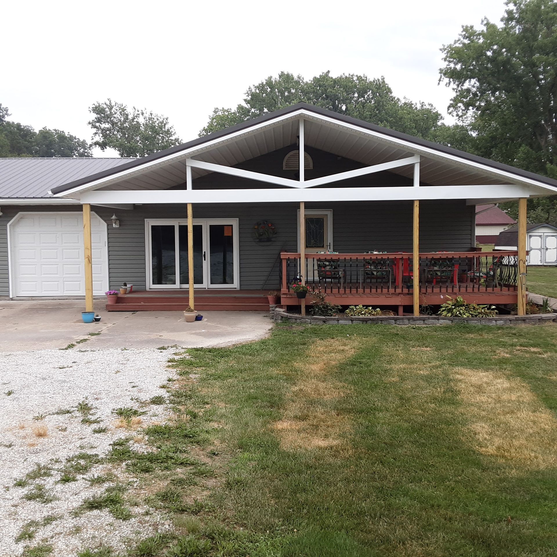 The front of a house with a porch and a garage