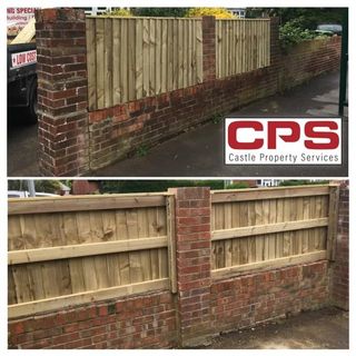fence fitted above low brick wall