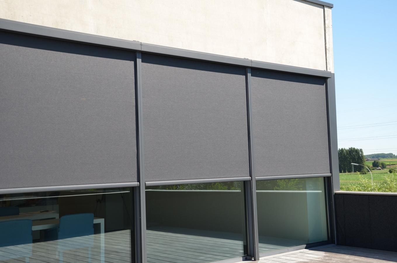 a large window with a gray blind on it