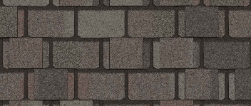 Close-up of brown roof shingles with a slightly rounded rectangular shape.