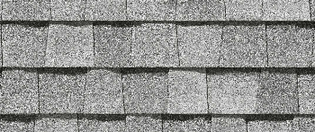 Close-up of gray asphalt roof shingles.