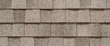 Close-up of brown roof shingles arranged in overlapping rows.