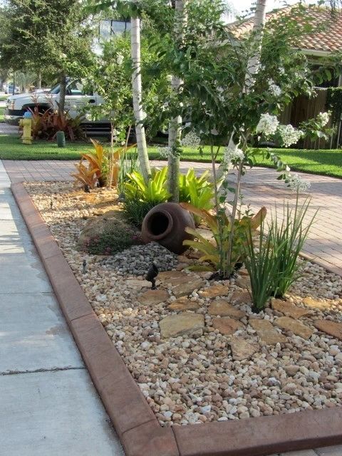 A garden with a large pitcher in the middle