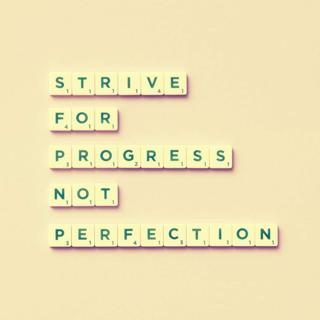 Scrabble tiles that say strive for progress not perfection