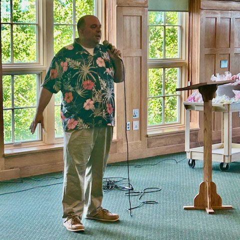 Pastor Paul entertaining the Lowrance teachers and staff.