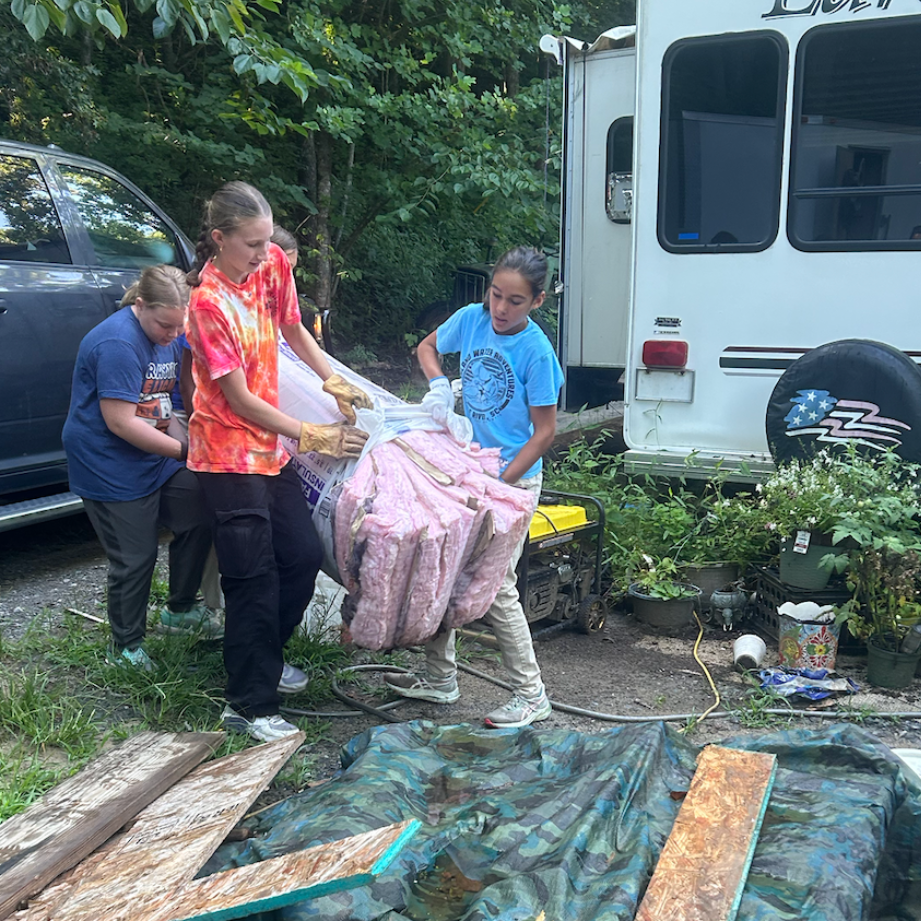 Youth working hard on mission trip.