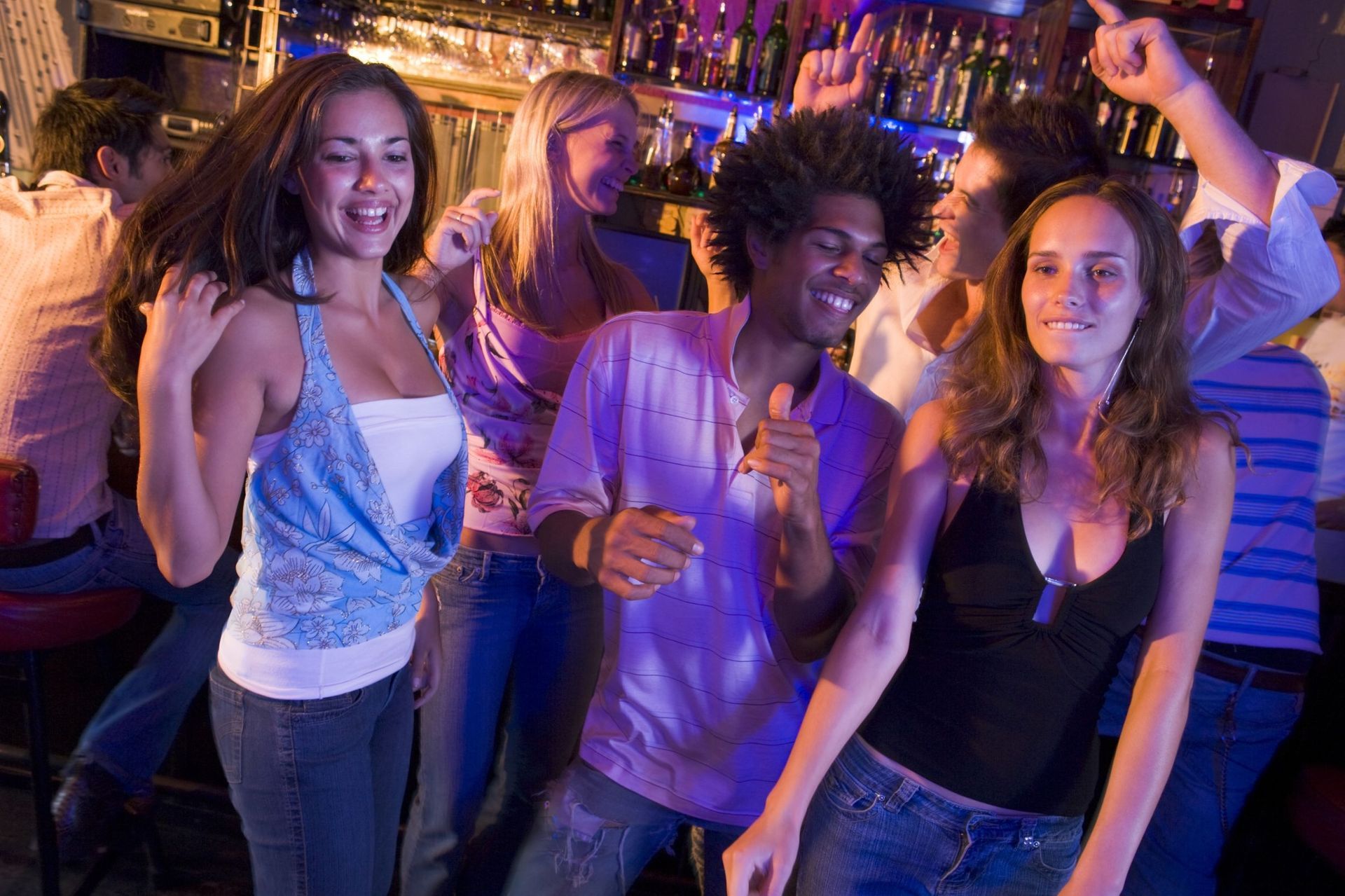 A group of people dancing.