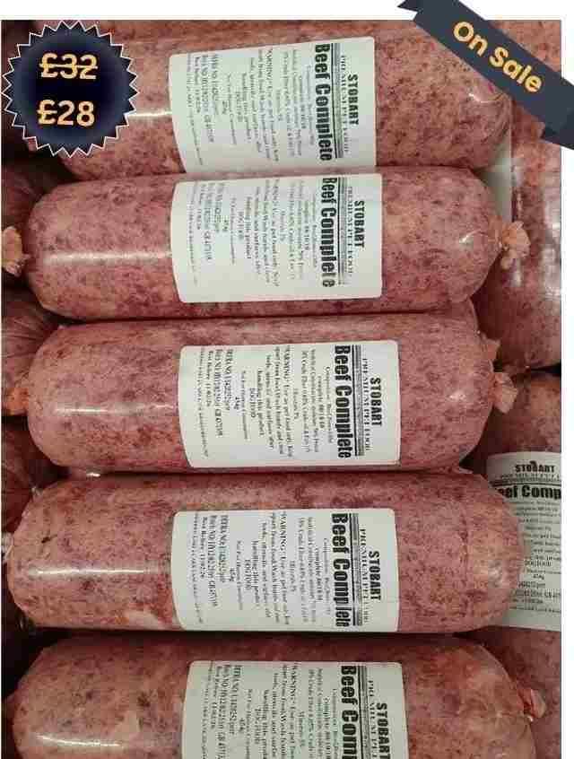 A stack of raw beef sausage rolls labeled