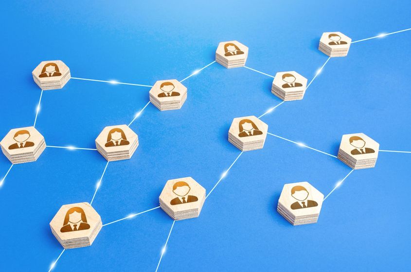 A network of people connected to each other on a blue background.