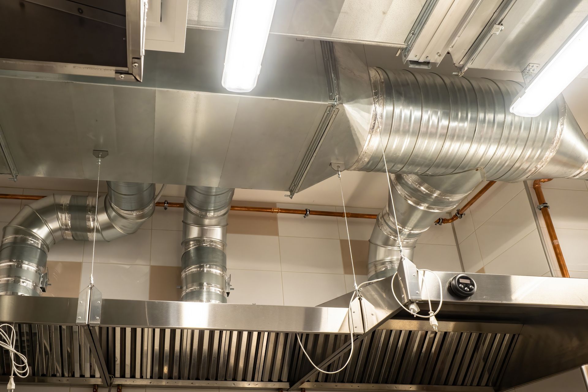 Stainless steel kitchen exhaust hood and ductwork.