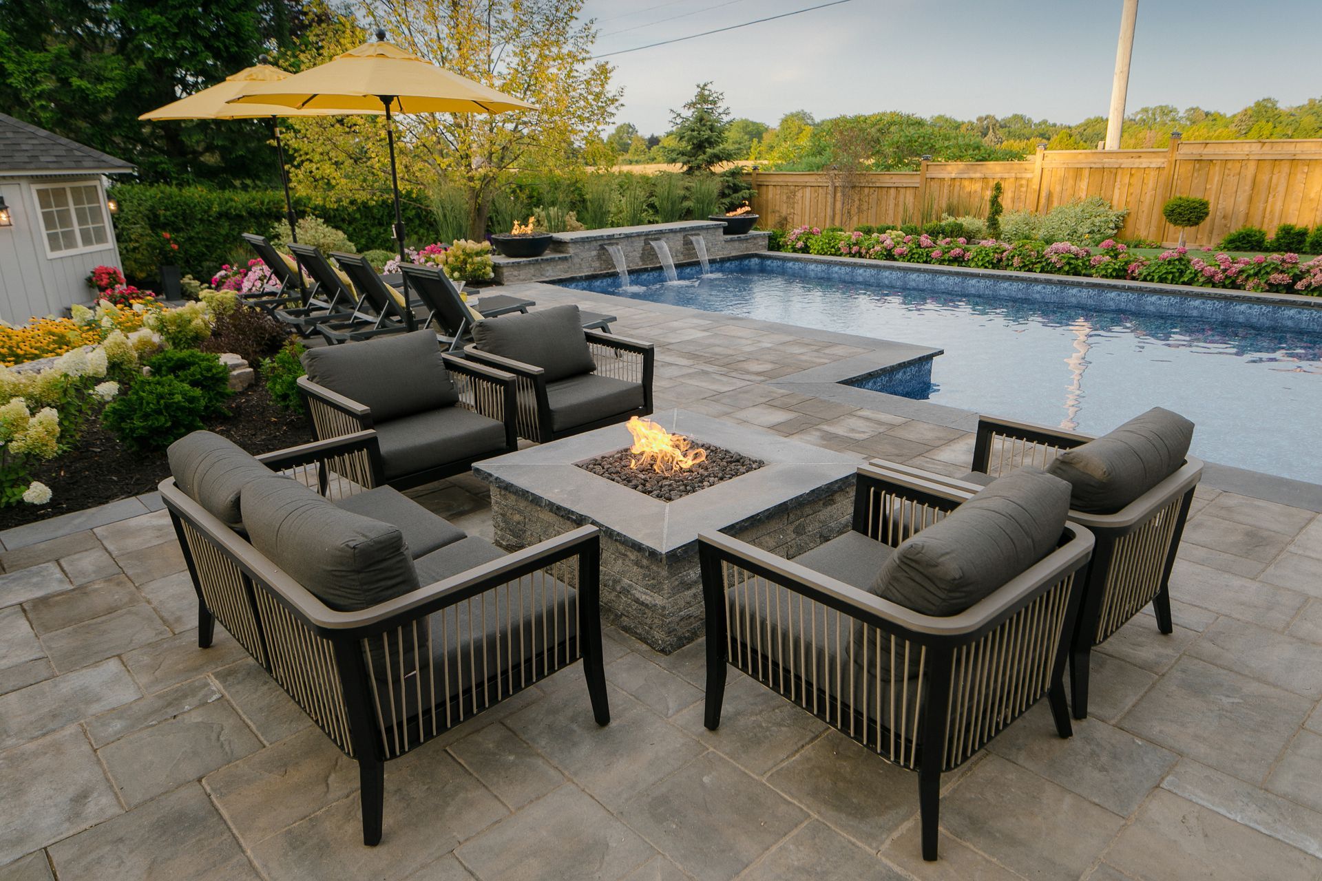 There is a fire pit in the middle of the patio.